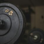 black and gray dumbbell on black surface